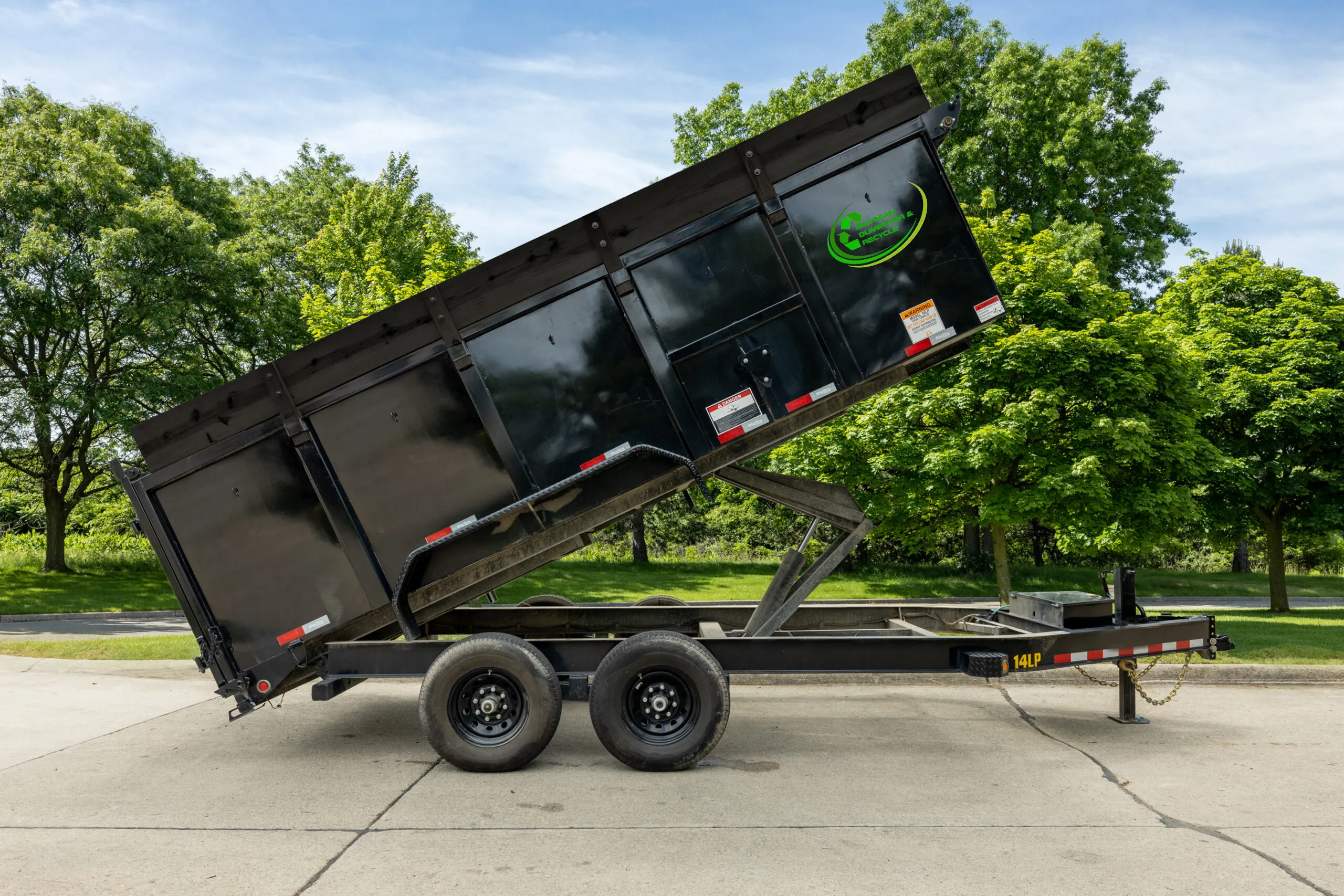Dump trailer raised to empty its load
